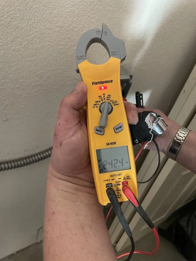 Voltage testing with clamp meter during Outlet Installation in New Britain